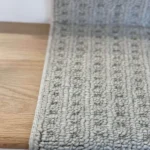 Close-up of gray textured loop carpet pile