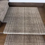 Grey plaid carpet landing and stair detail