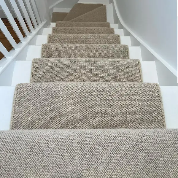 Loop-pile __Wool Snug stair runner__ with a cream whipped edge.