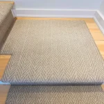 Patterned carpet runner on a wide stair landing