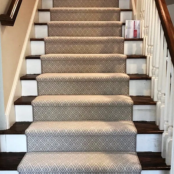Tan geometric diamond pattern wool stair runner.