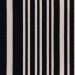 striped carpet with varied widths of bold black and cream vertical lines.